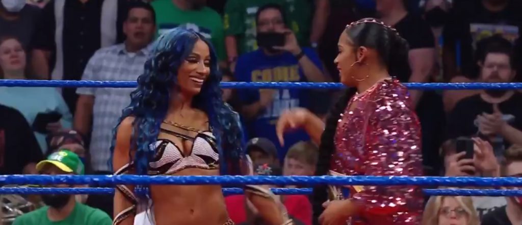 WWE Smackdown Results (7/30) – John Cena Insults Roman Reigns and Drops Baron Corbin with an Attitude Adjustment; Rey Mysterio w/Dominik Mysterio Defeated Jimmy Uso w/Jey Uso by Pinfall; Sasha Banks Returns to Save Bianca Belair from Carmella and Zelina Vega WWE Smackdown Results