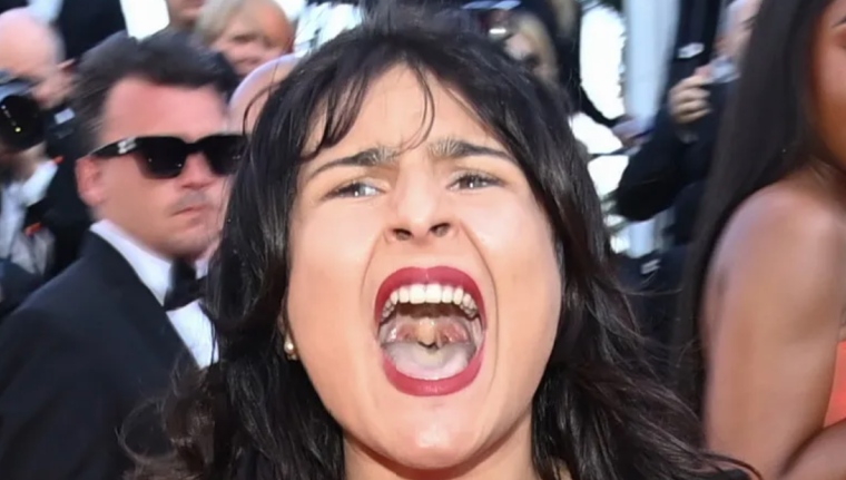 Topless Woman Storms Cannes Film Festival To Protest Russian Brutality Against Ukraine – ‘Stop Raping Us’