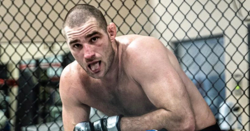 UFC: Sean Strickland Punches Izzy Fan “Right in the Guts”